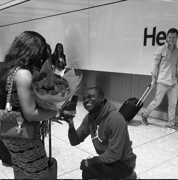 Tonto Dikeh's Ex-boyfriend, Malivelihood Propose To His Girlfriend, Deola At The Heathrow Airport (Photo)