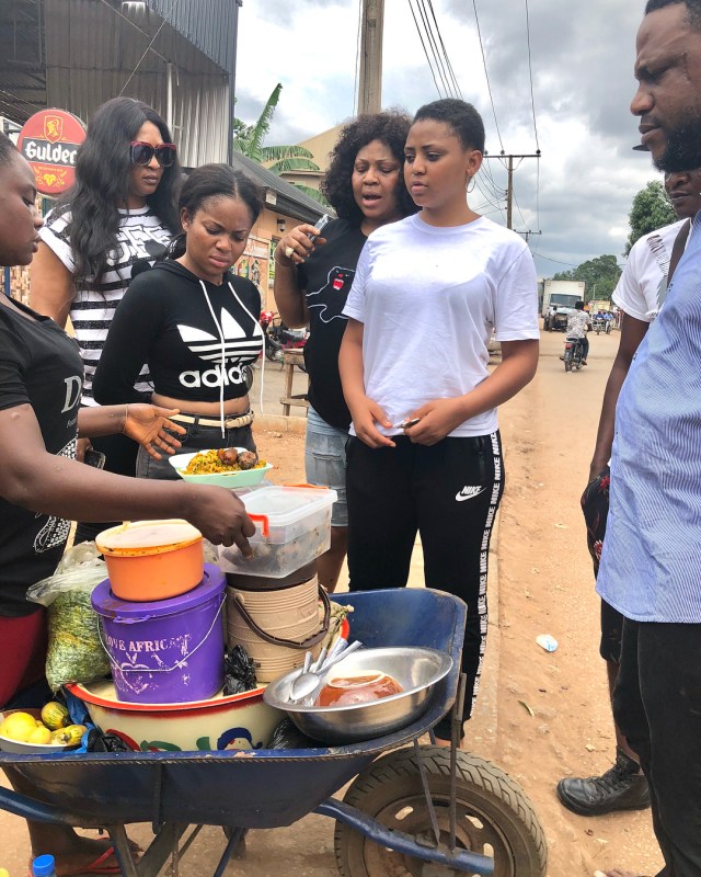 Regina Daniels pictured eating Abacha by the roadside (photos)