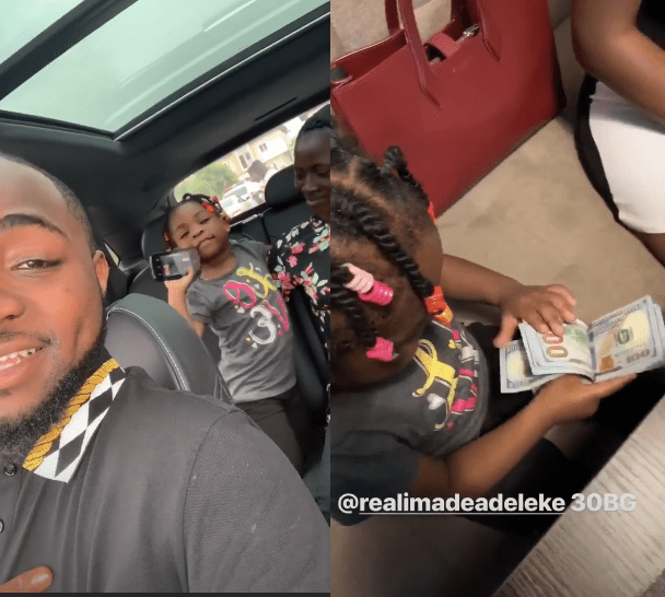 Davido's daughter, Imade plays with bundle of $100 bills