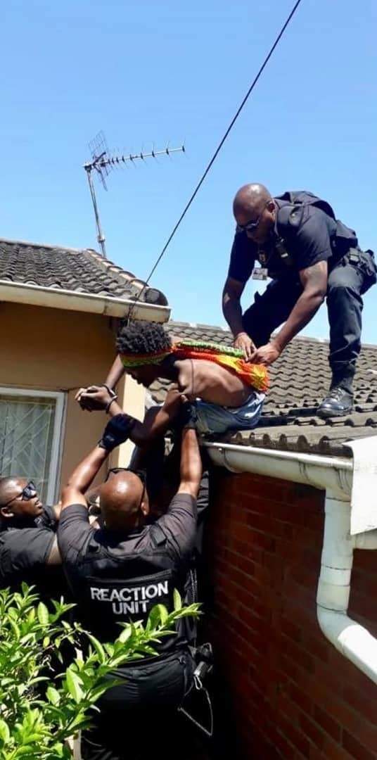 Man high on drugs begs police to shoot him after climbing roof