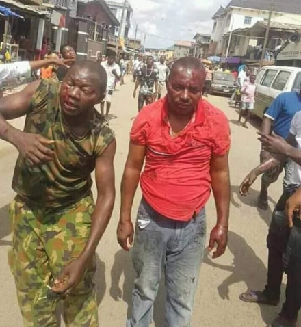 Brave soldier beaten black and blue for preventing touts from carrying out jungle justice (Photos)