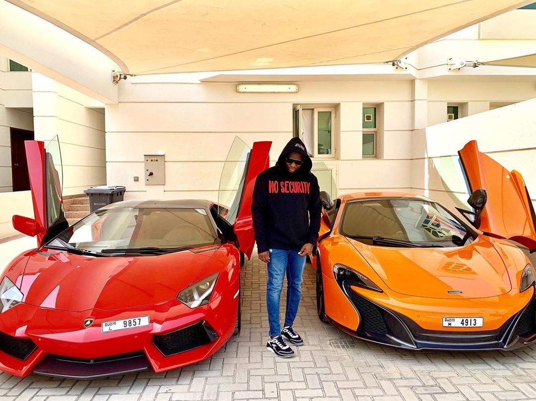 "My money so powerful I brag different" - Mompha says as he shows off his Lamborghini and McLaren in new photo