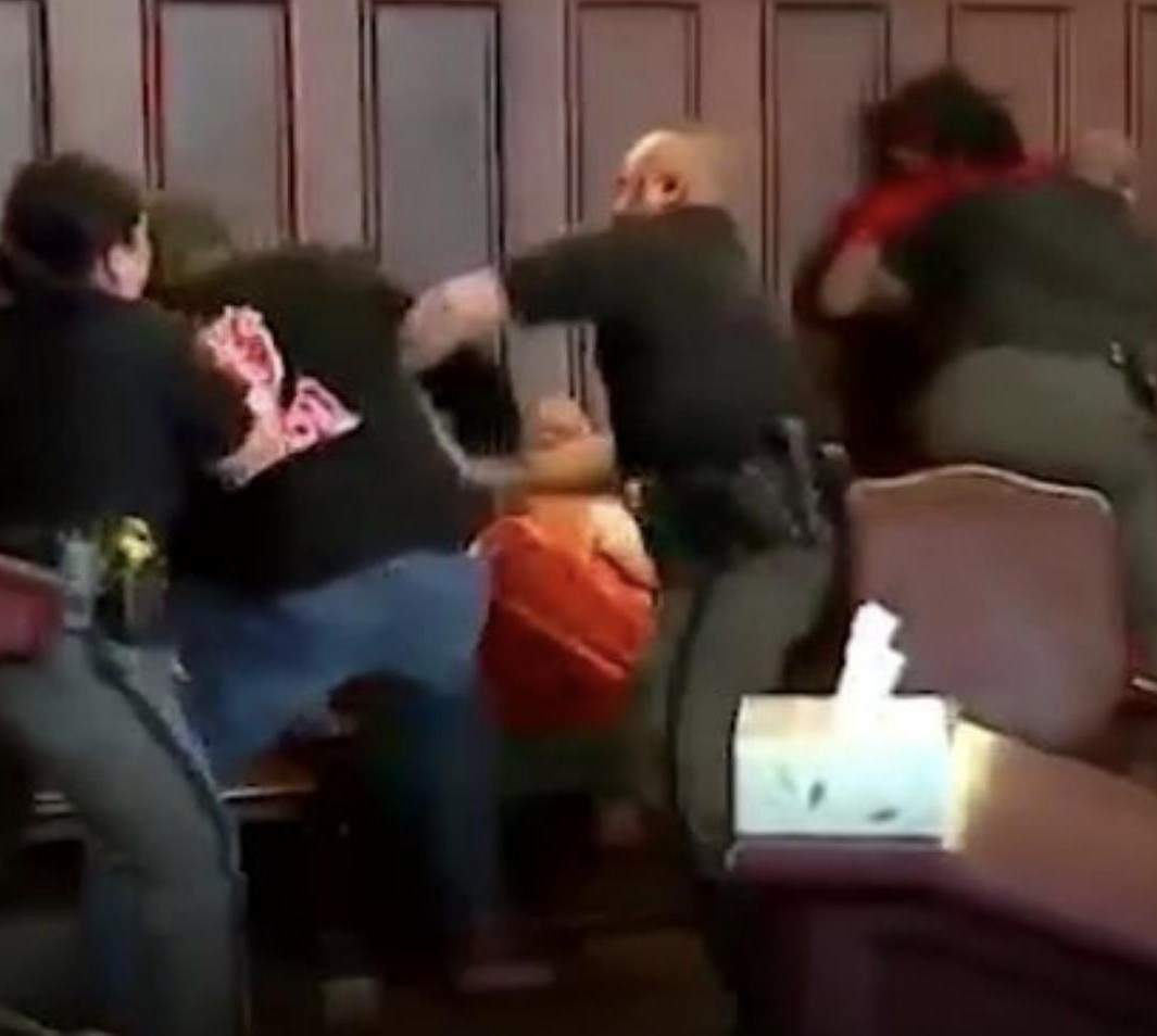 Brothers jailed after they attacked their mother's killer in dramatic court room brawl (Photos)