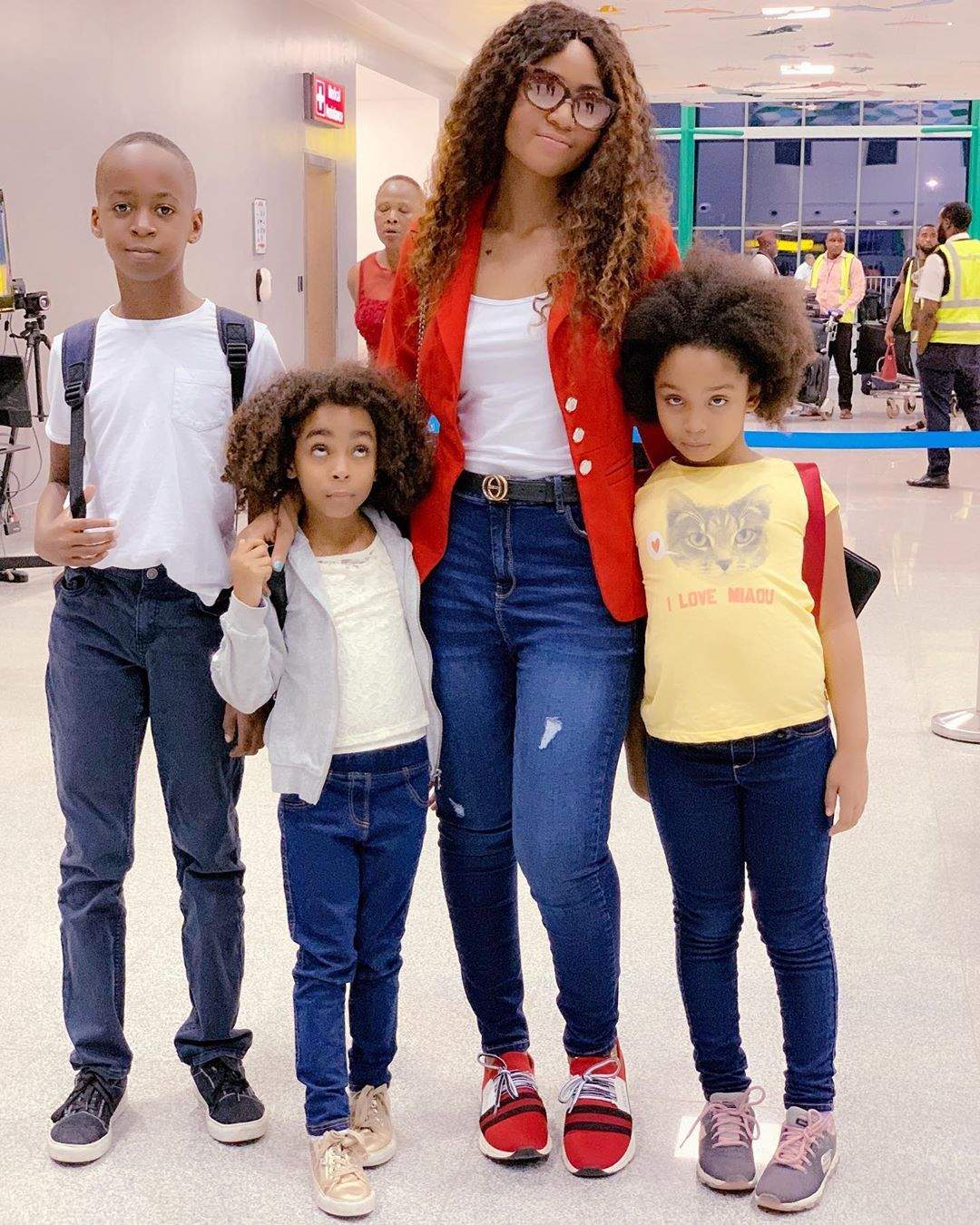 Regina Daniels jets out with her stepchildren for vacation (Photos)