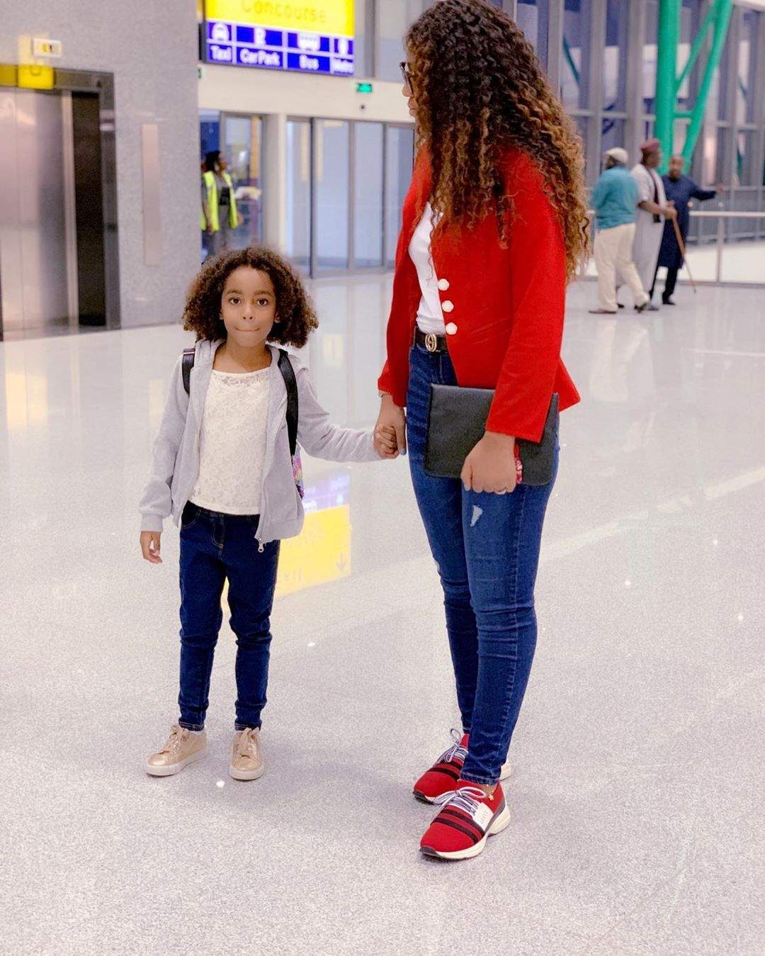 Regina Daniels jets out with her stepchildren for vacation (Photos)