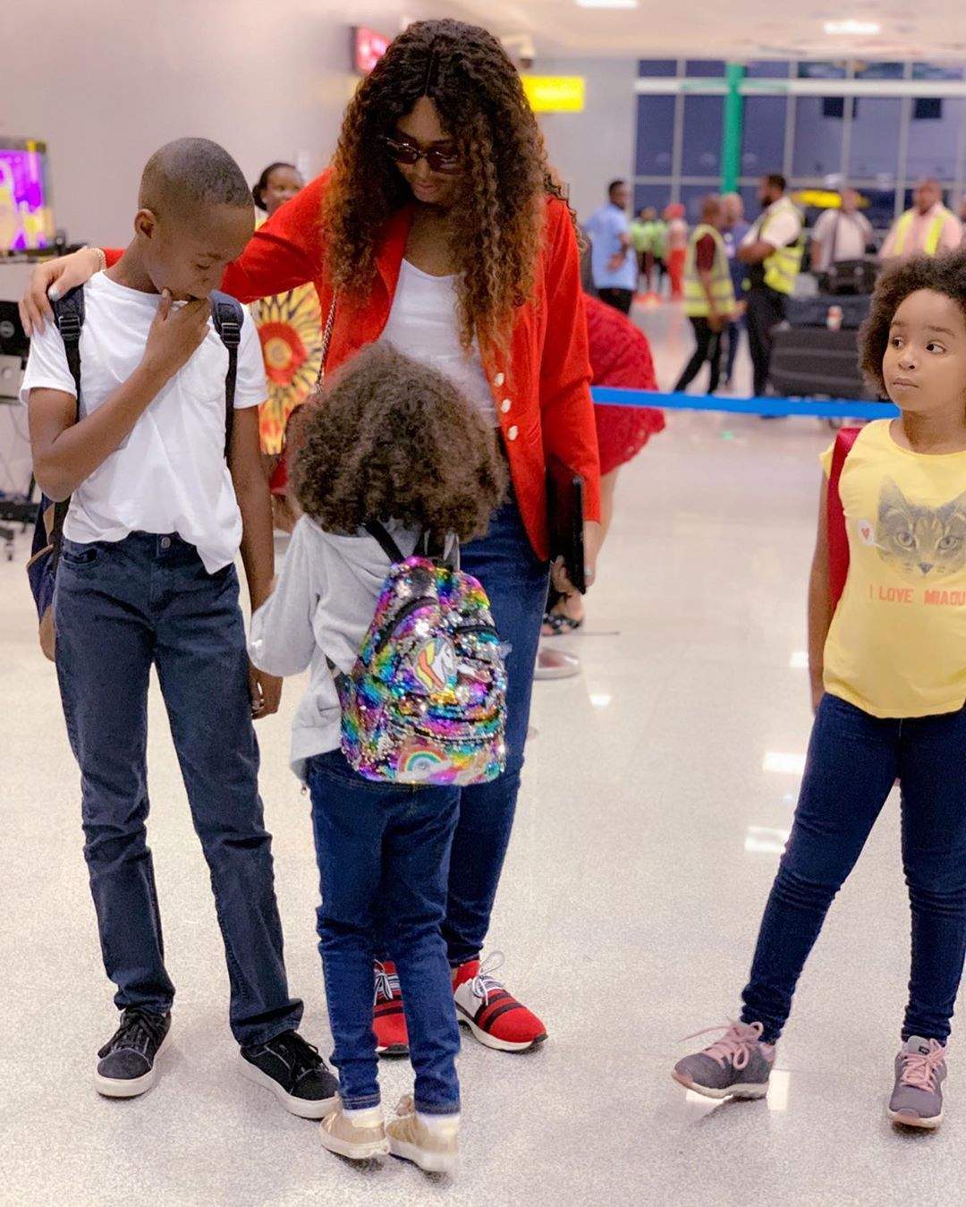 Regina Daniels jets out with her stepchildren for vacation (Photos)