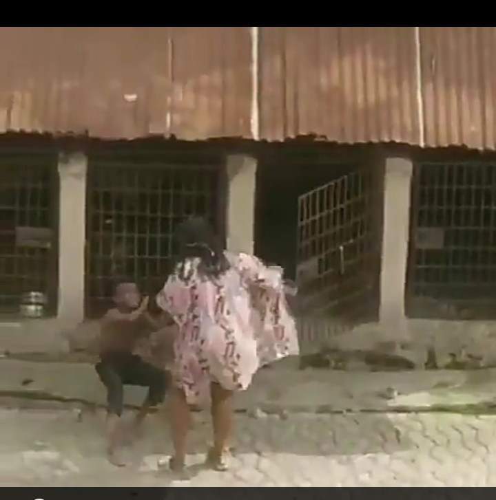 Outrage as Nigerian lady is videoed flogging a child and locking him up in cage with fierce dogs