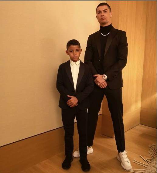 GOALS! - Cristiano Ronaldo and his son strike a pose in matching suits (Photo)