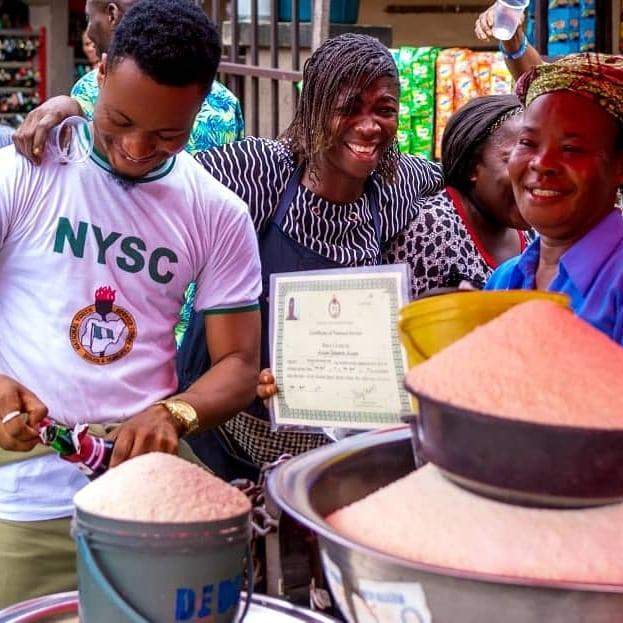 Graduate celebrates with his mom at the market after passing out of NYSC