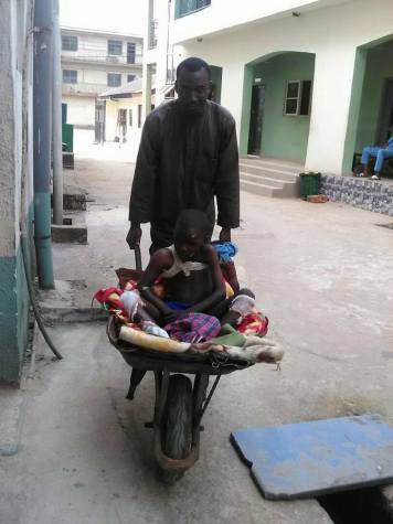 Nigerian Man Takes Son To The Hospital In A Wheelbarrow In Imo State (Photos)
