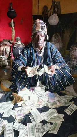 Nigerian Native Doctor From Ogun State Poses With Dollars And Other Foreign Currencies (Photos)