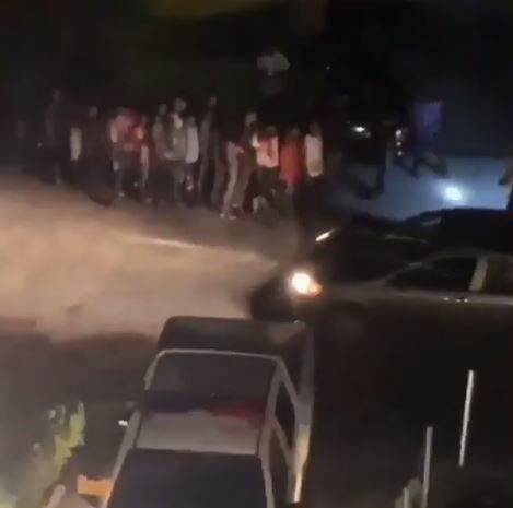 Fans Queue in front of Davido's House to Collect Money