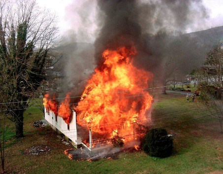 Angry Woman sets house on fire because she was not invited to a party (Photo)