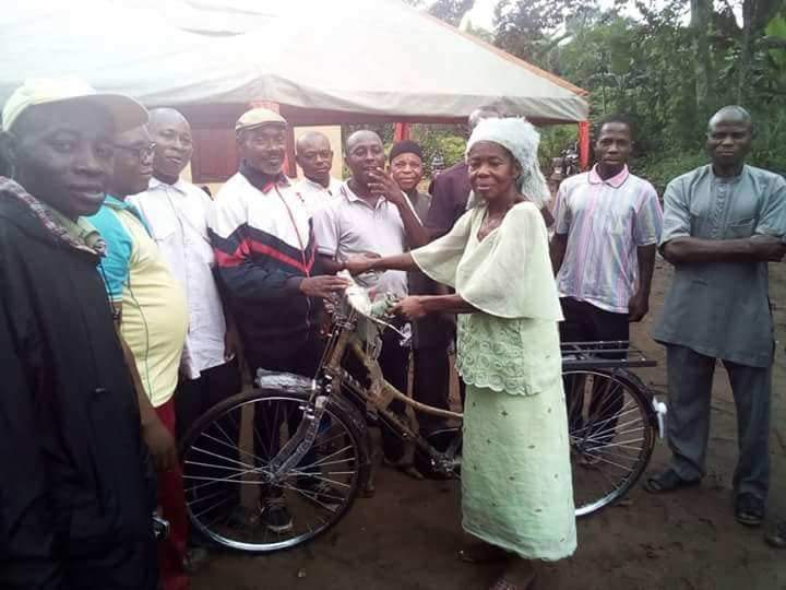 Abia State House Of Assembly speaker's aide empowers old woman with a bicycle