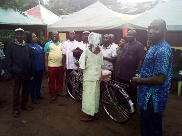 Abia State House Of Assembly speaker's aide empowers old woman with a bicycle