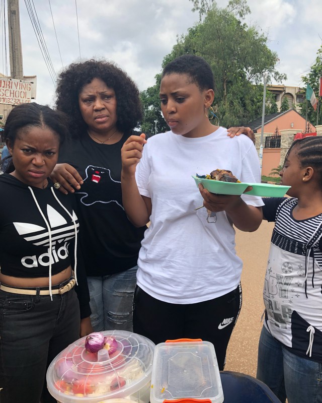 Regina Daniels pictured eating Abacha by the roadside (photos)