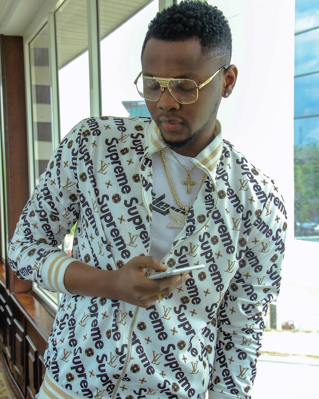 Kiss Daniel busted by foreign account for wearing fake designer wears