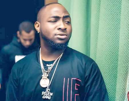 Davido says he is sorry after he was called out for body-shaming his critic