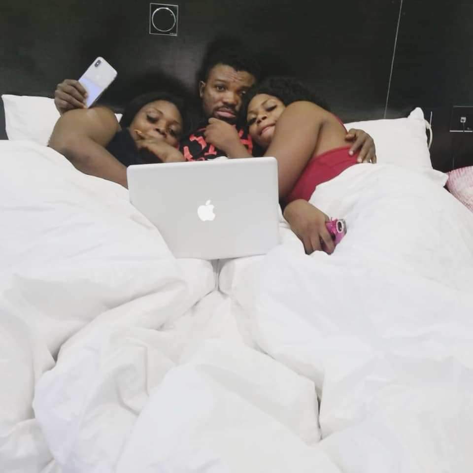 Man relaxes with two ladies in bed after being hospitalized for fainting (Photos)