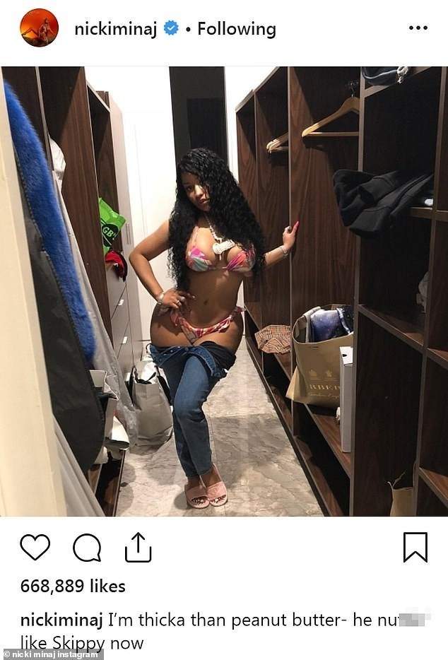Nicki Minaj takes down her jeans to reveal her skimpy underwear in new photo.