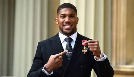 Anthony Joshua awarded OBE by Prince Charles for services to Sport (photos)