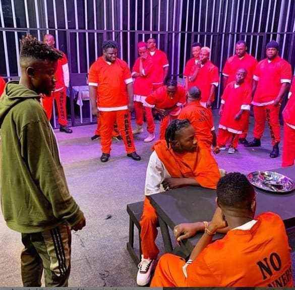 Naira Marley Recreates EFCC Mugshot With Crew