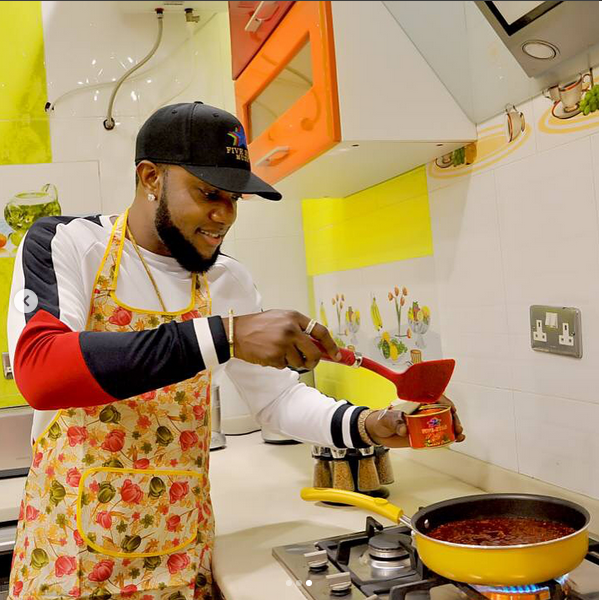 Kcee Shares Photo Of Himself Cooking With Five Star Tomato Paste