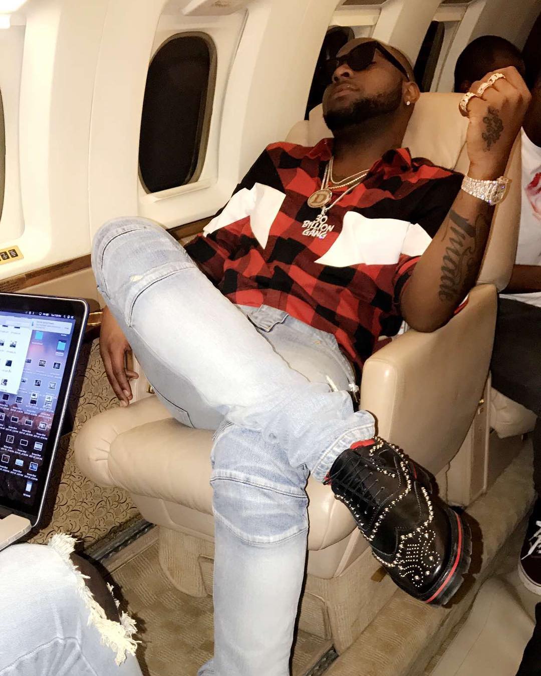 Davido Shows Off Expensive Shoes On Board Private Jet