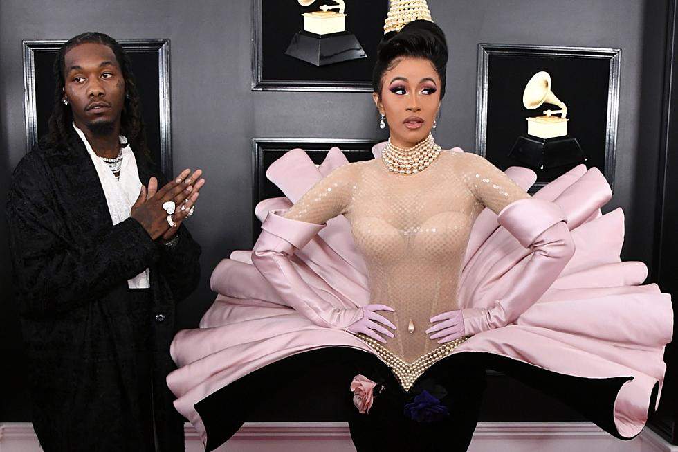 Cardi B and Offset kiss each other at the 2019 Grammy Awards