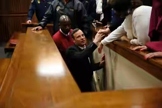 Photos: Oscar Pistorius Kisses His Family Goodbye As He's Led To Prison