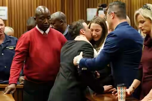 Photos: Oscar Pistorius Kisses His Family Goodbye As He's Led To Prison