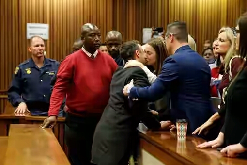 Photos: Oscar Pistorius Kisses His Family Goodbye As He's Led To Prison