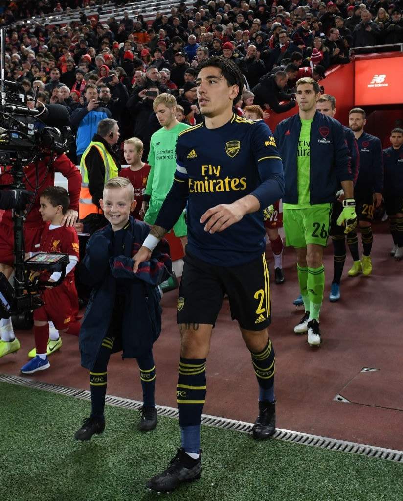 Touching: Arsenal star spots boy shivering before Liverpool game and does something remarkable