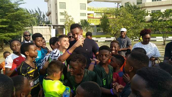 Checkout what Super Eagles captain Mikel was spotted doing with children in Lagos (photos)