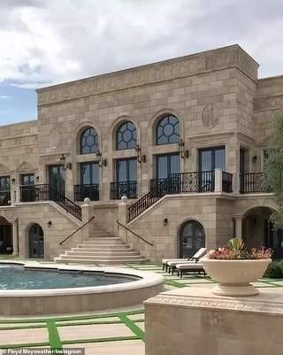 Floyd Mayweather shows off his gigantic new home that has a cinema, 225-bottle wine rack and candy shop (photos)