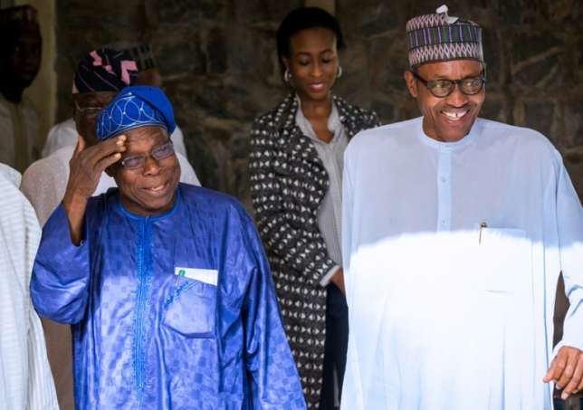 Happier times: Obasanjo, left, chats with Buhari, then president-elect, after the 2015 elections (APC/AFP)