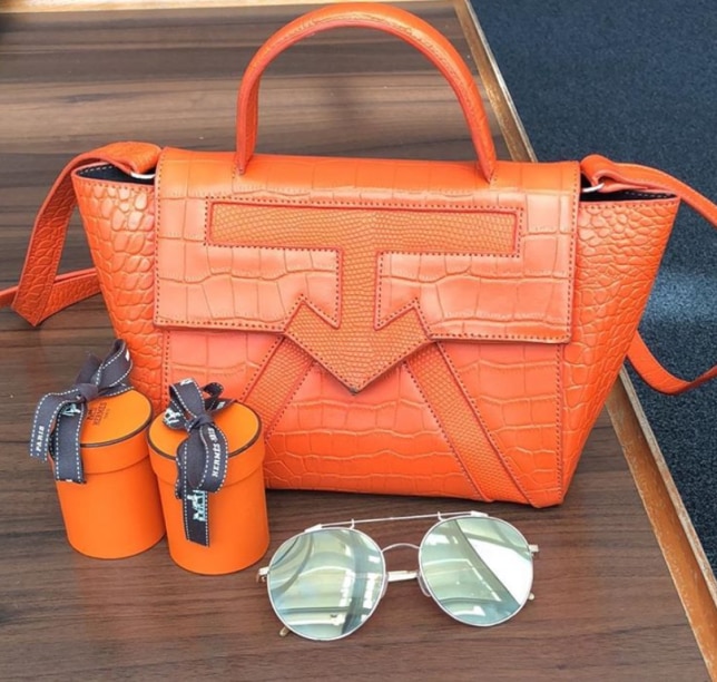 Toke Makinwa luxury leather bag in orange (Instagram/ @tokemakinwa)