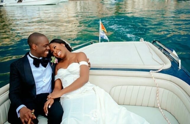 The happy couple from #omgwedding relax on a boat in Montenegro and the bride is wearing her stunning Andrea Iyamah wedding gown. (Instagram/ @misudoh)